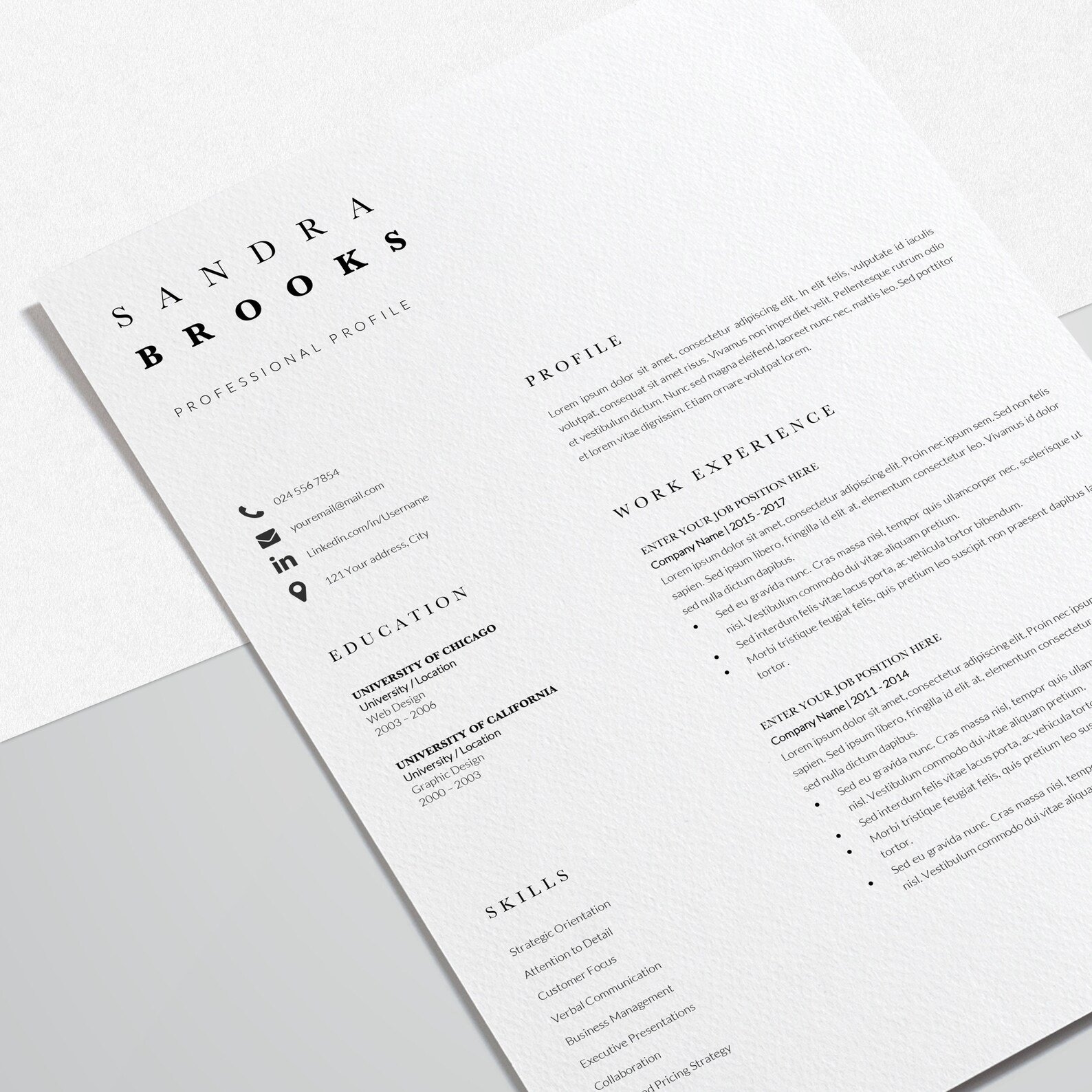 White and black resume on top of a table.
