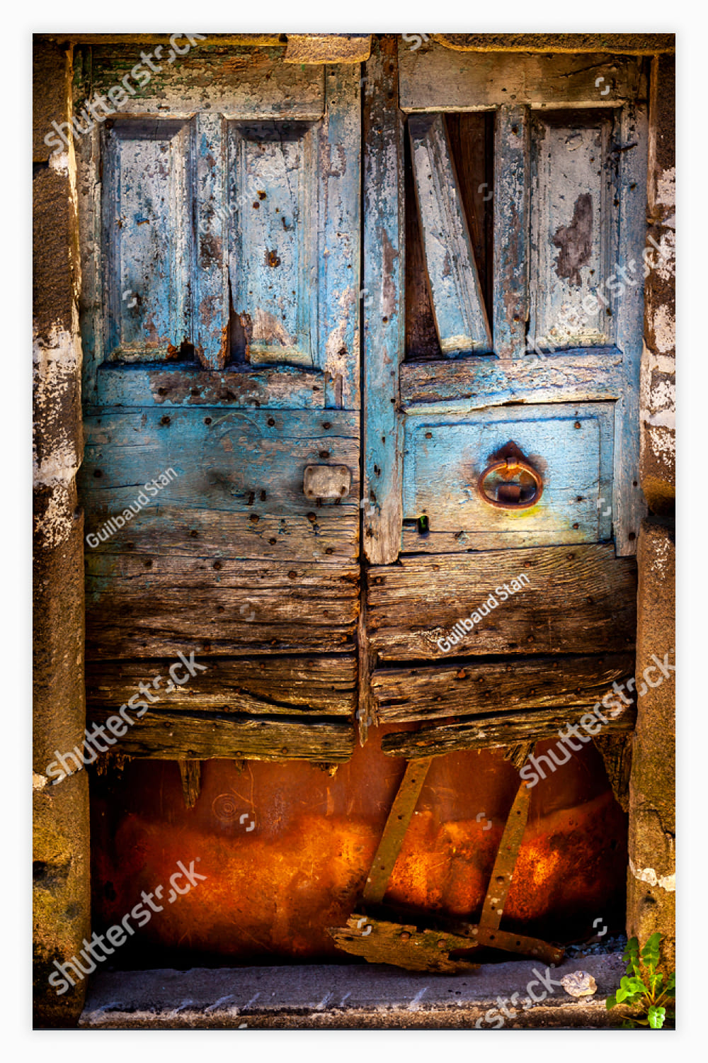 old wooden door painted with Blue pastel colours.