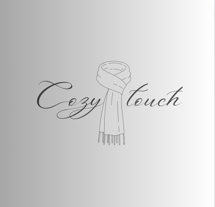 White scarf with the word cozy touch written on it.