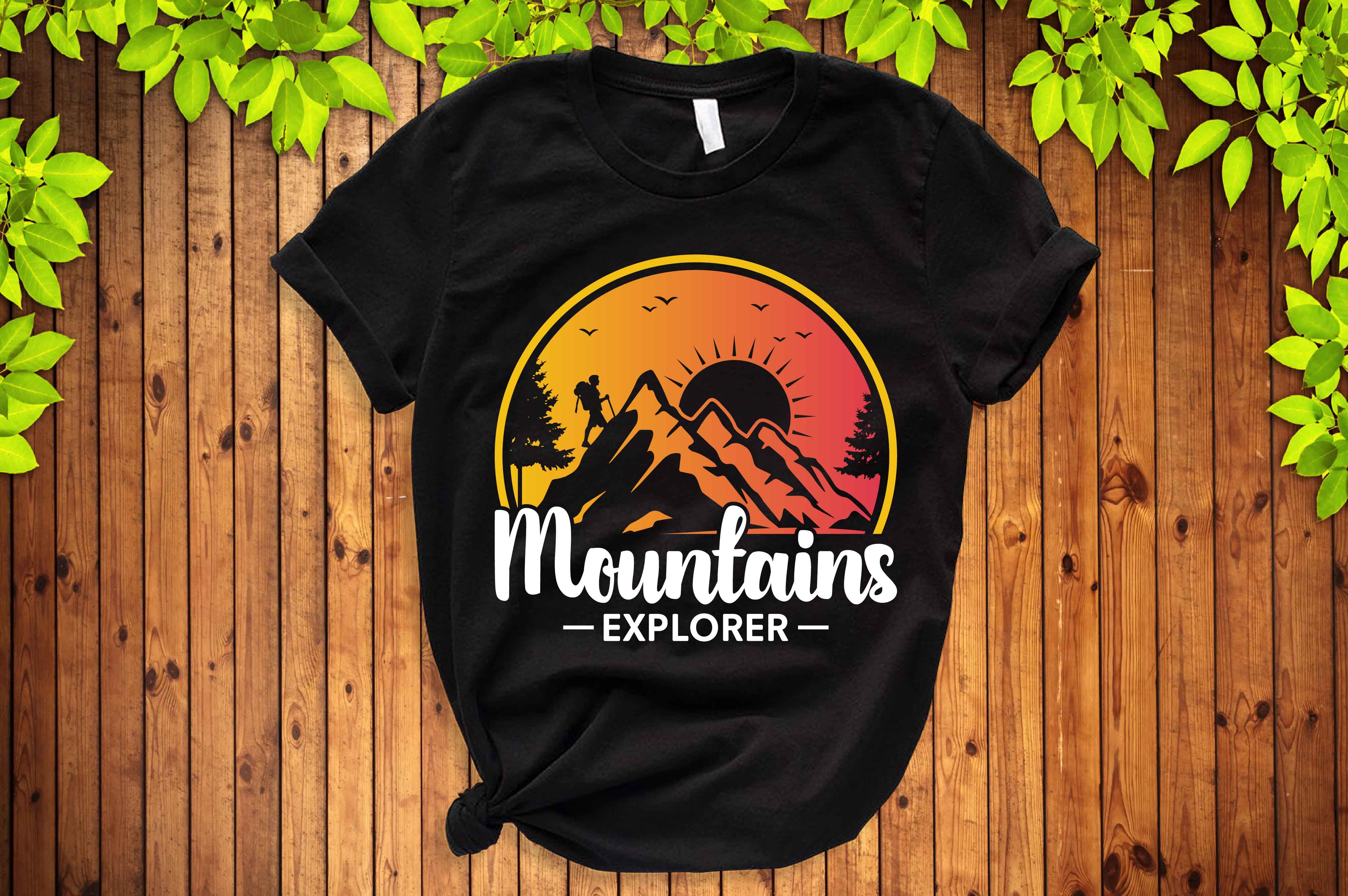 Black t - shirt with the mountains explorer on it.
