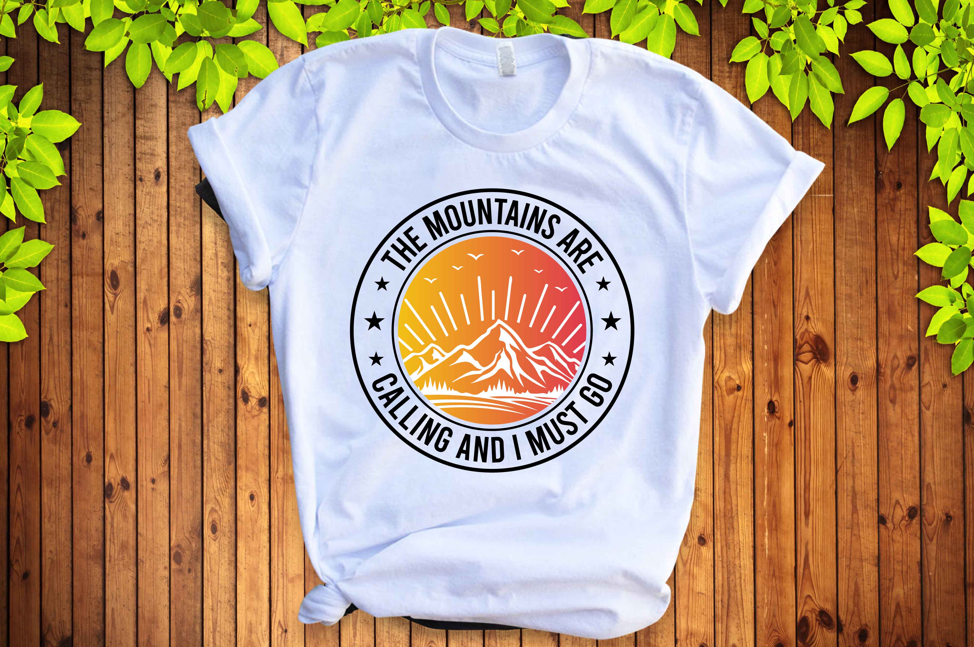 White t - shirt with the mountains are calling and calling on it.