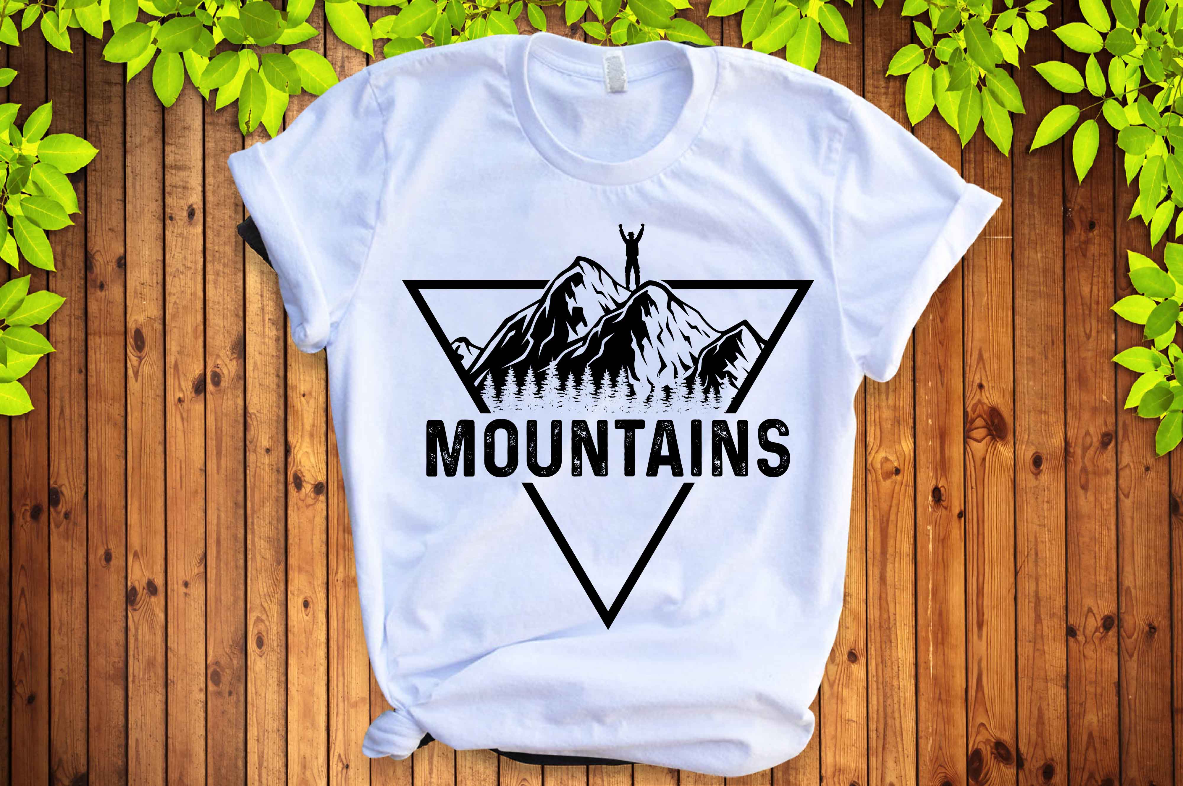 White t - shirt with the words mountains printed on it.