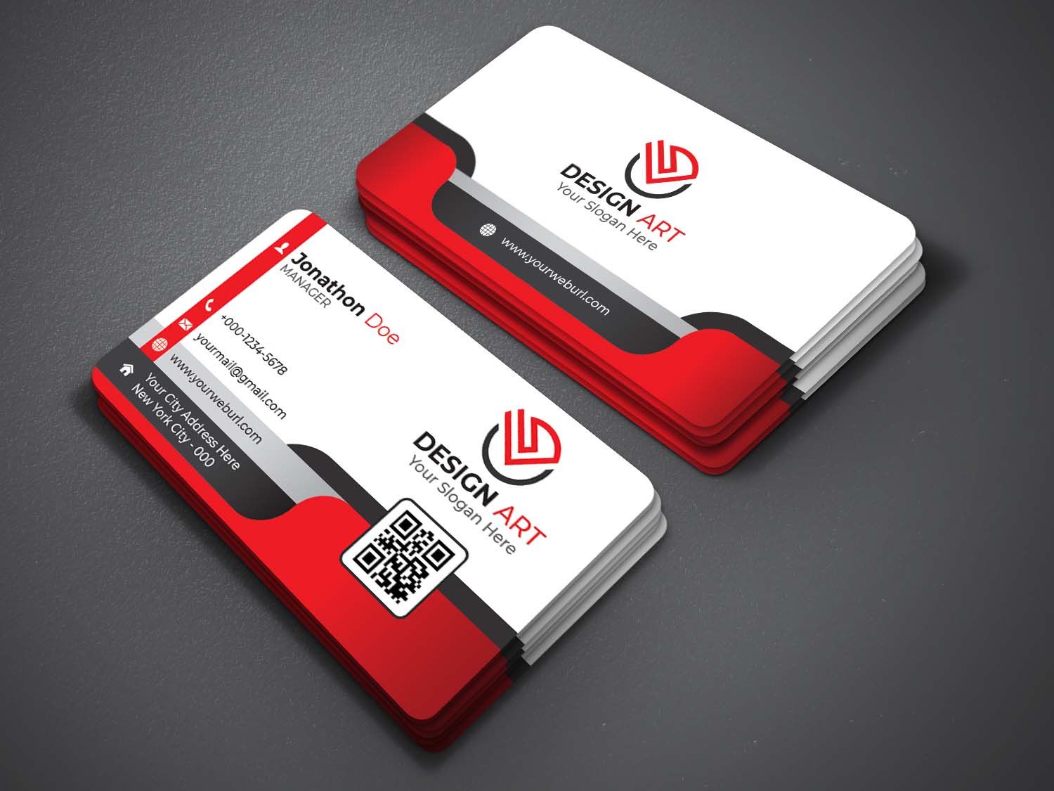 Two red and white business cards on a gray surface.