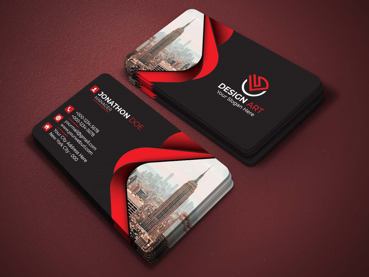 Black and red business card on a red surface.