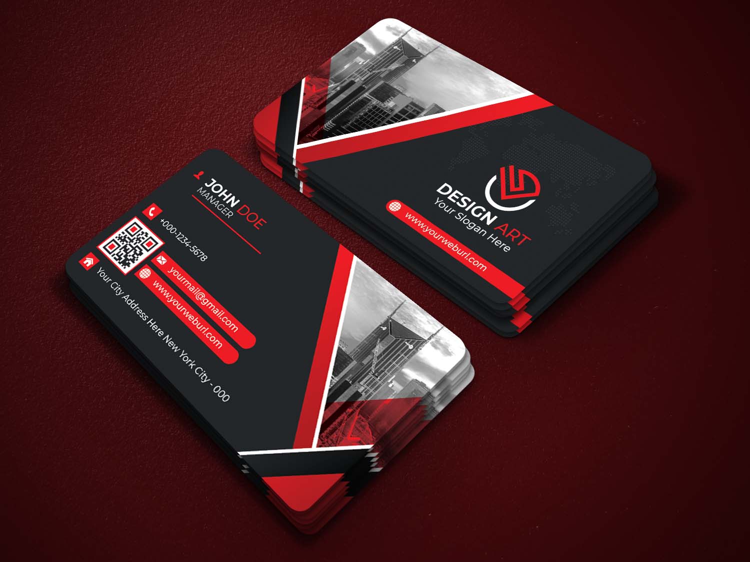 Red and black business card on a red surface.