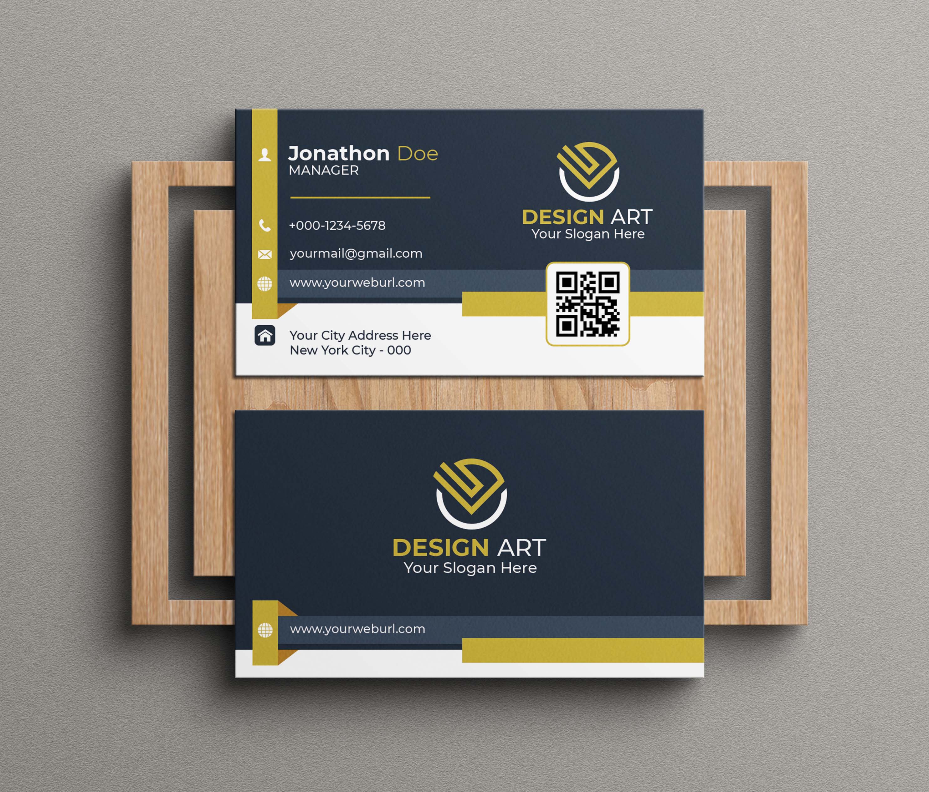 Two business cards with a wooden frame.