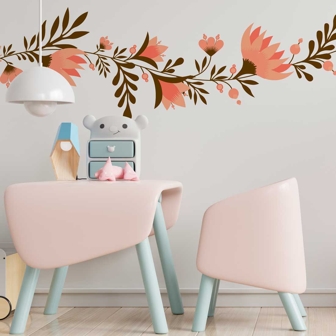 Room with a table and two chairs and a wall with flowers on it.