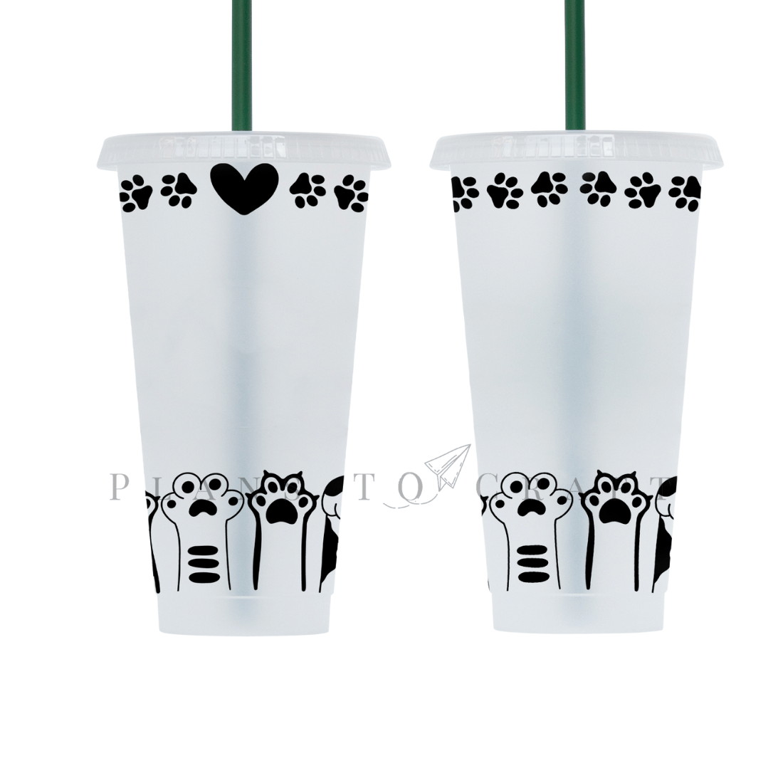 Two white cups with black designs on them.
