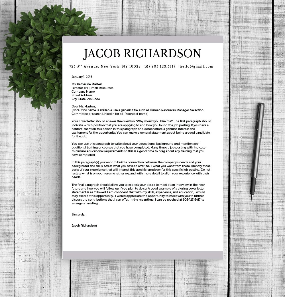 Letterhead with a pen and a plant on top of it.