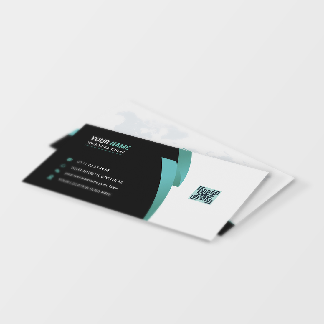 White and black business card on a white surface.