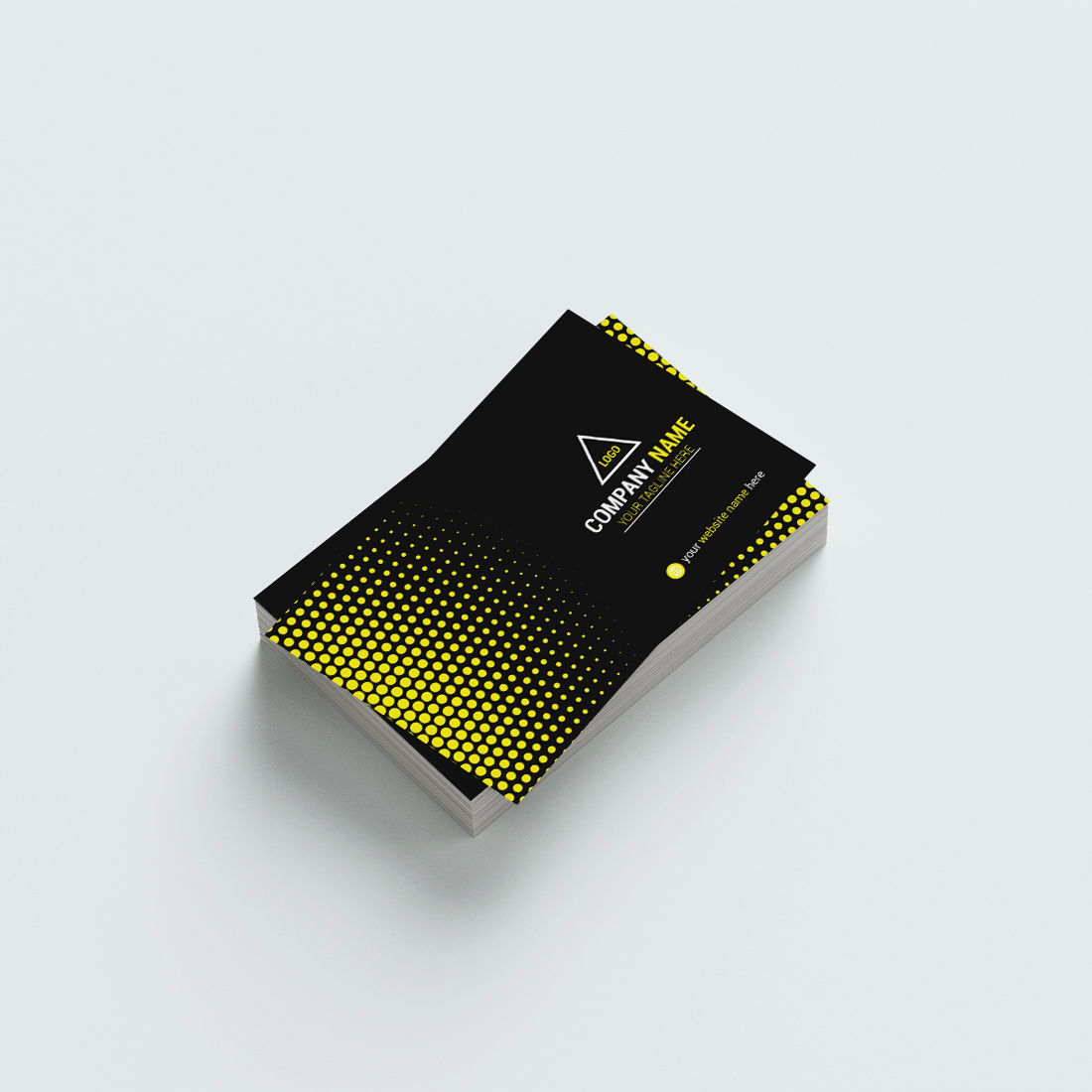 Black and yellow business card on a white surface.