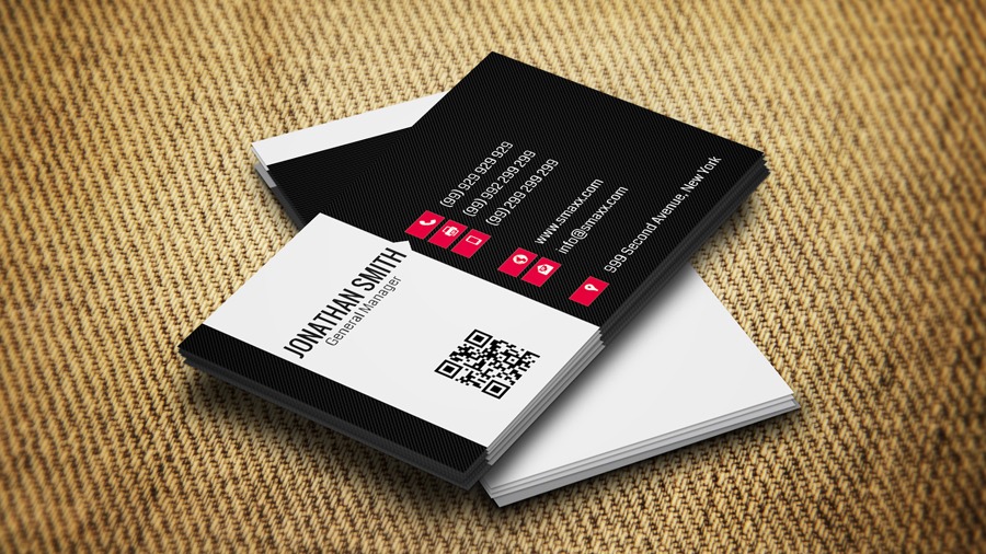 Two black and white business cards on a brown background.