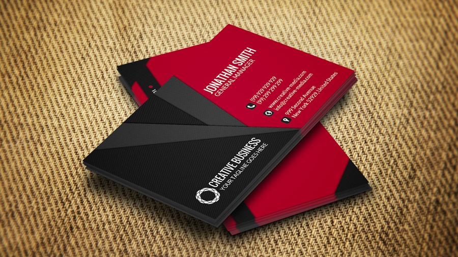 Two red and black business cards sitting on top of each other.