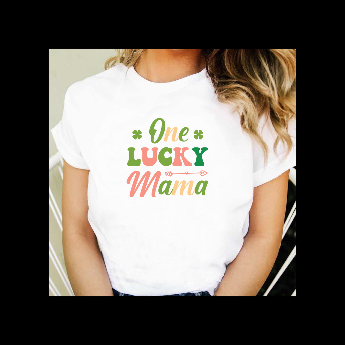 Woman wearing a t - shirt that says one lucky mama.