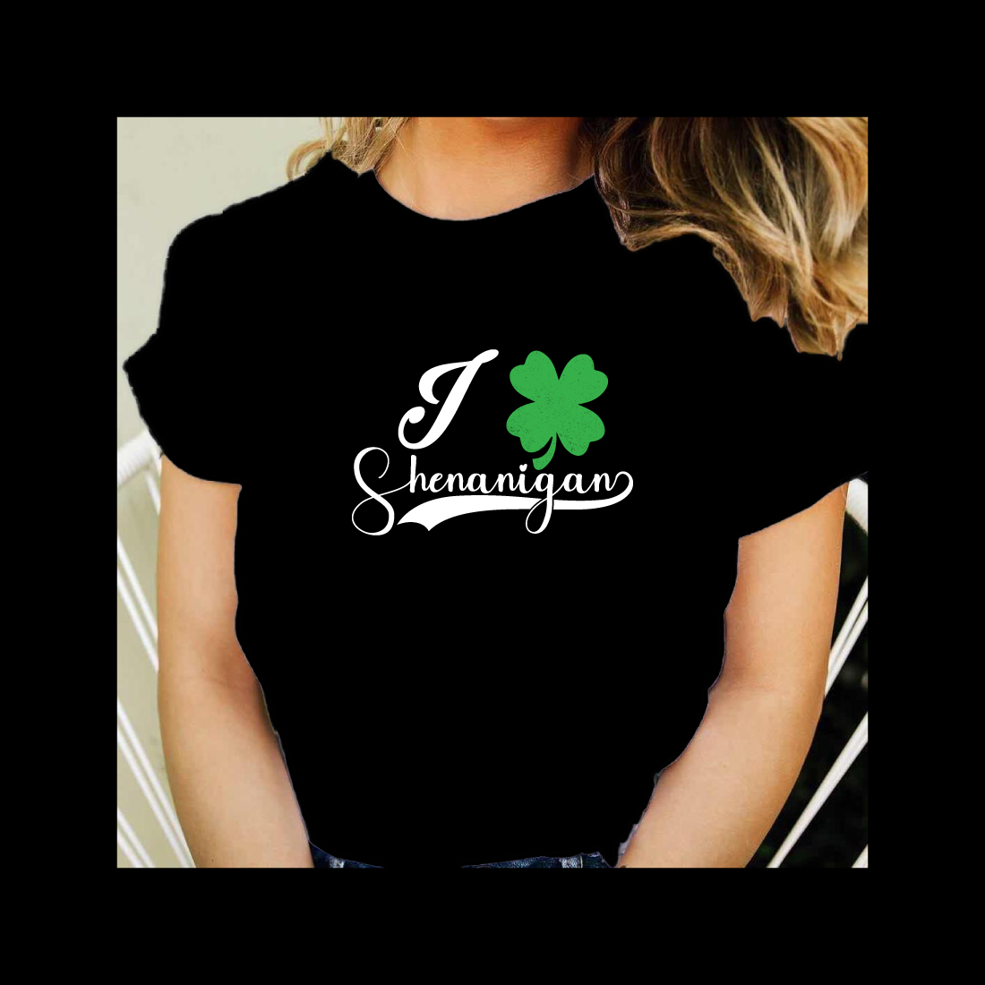 Woman wearing a black shirt with a shamrock on it.