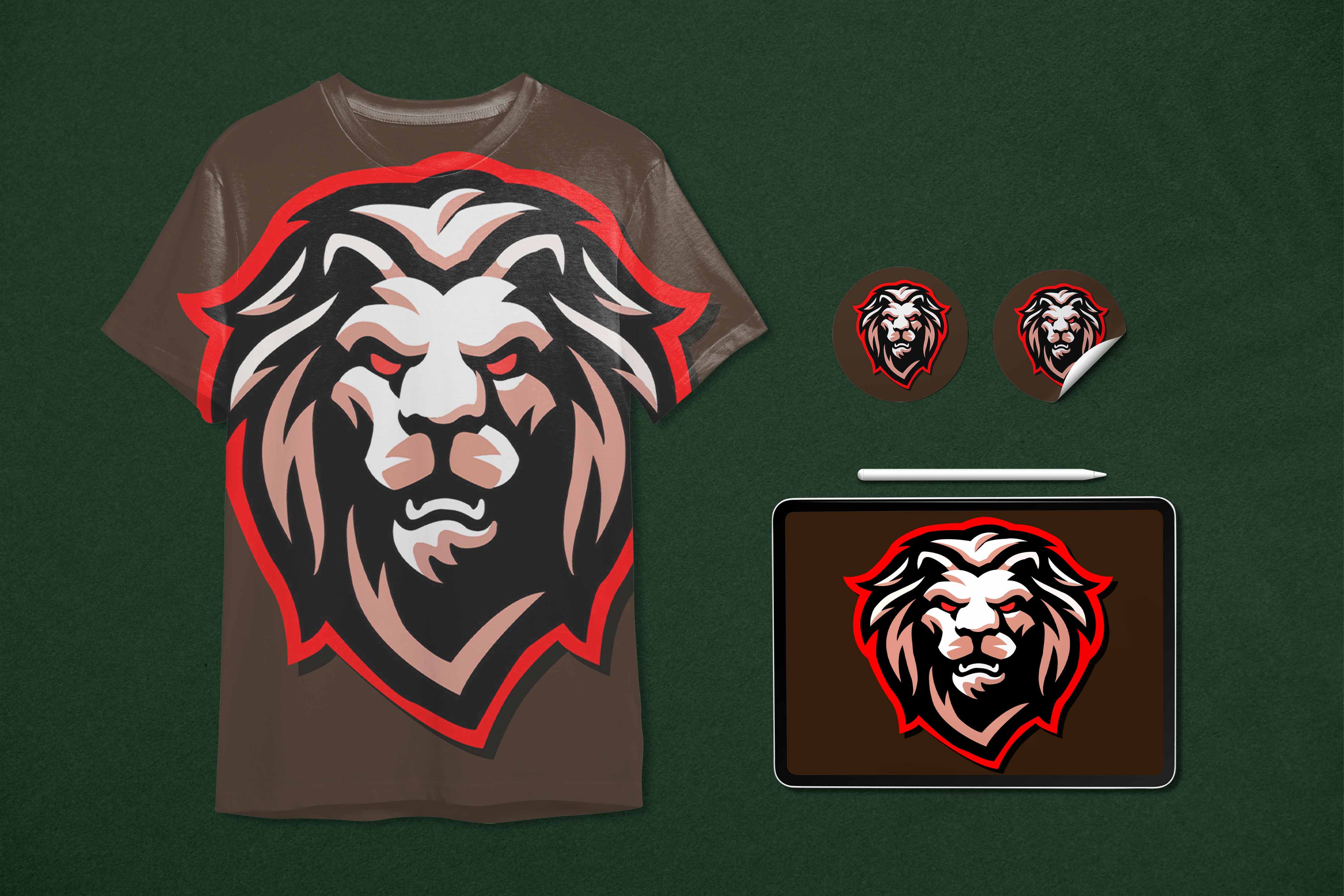 T - shirt with a lion's head on it next to a laptop.