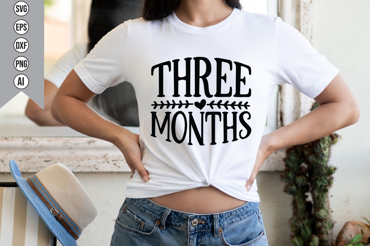 Woman wearing a t - shirt that says three months.