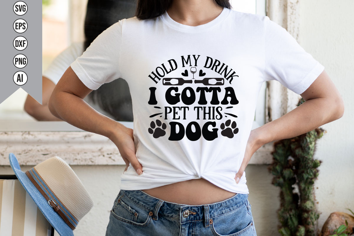Woman wearing a t - shirt that says i gota pet this dog.