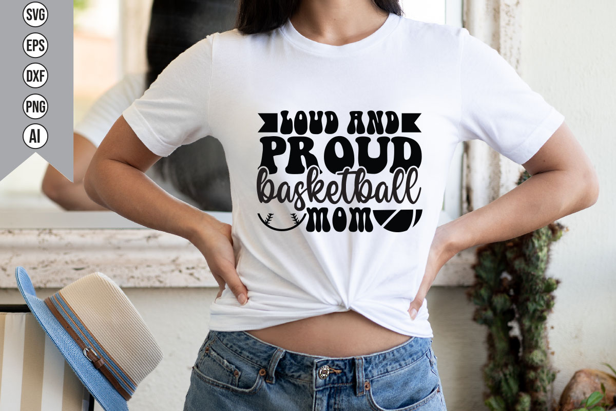 Woman wearing a t - shirt that says proud basketball mom.