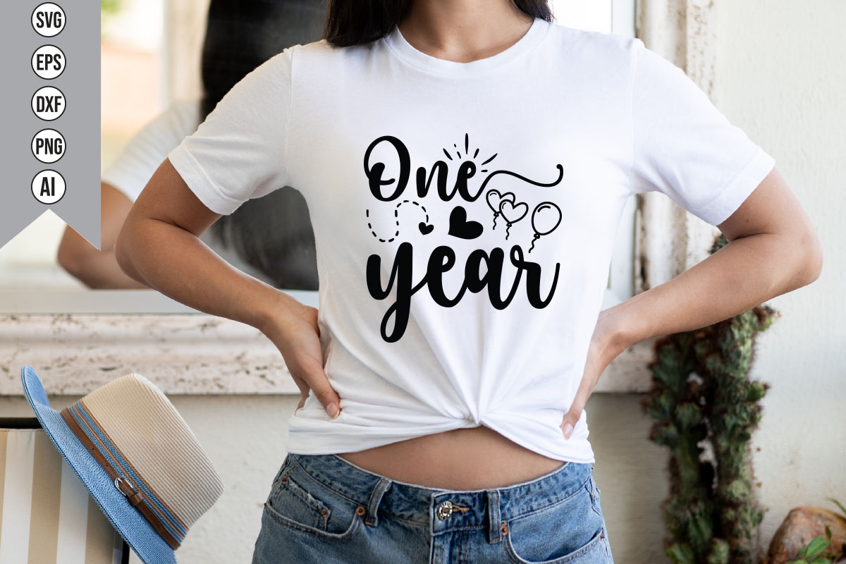 Woman wearing a t - shirt that says one year.