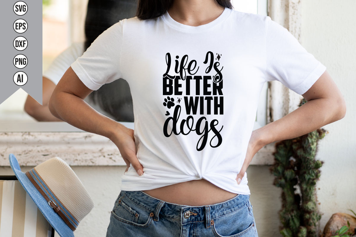 Woman wearing a t - shirt that says life is better with dogs.