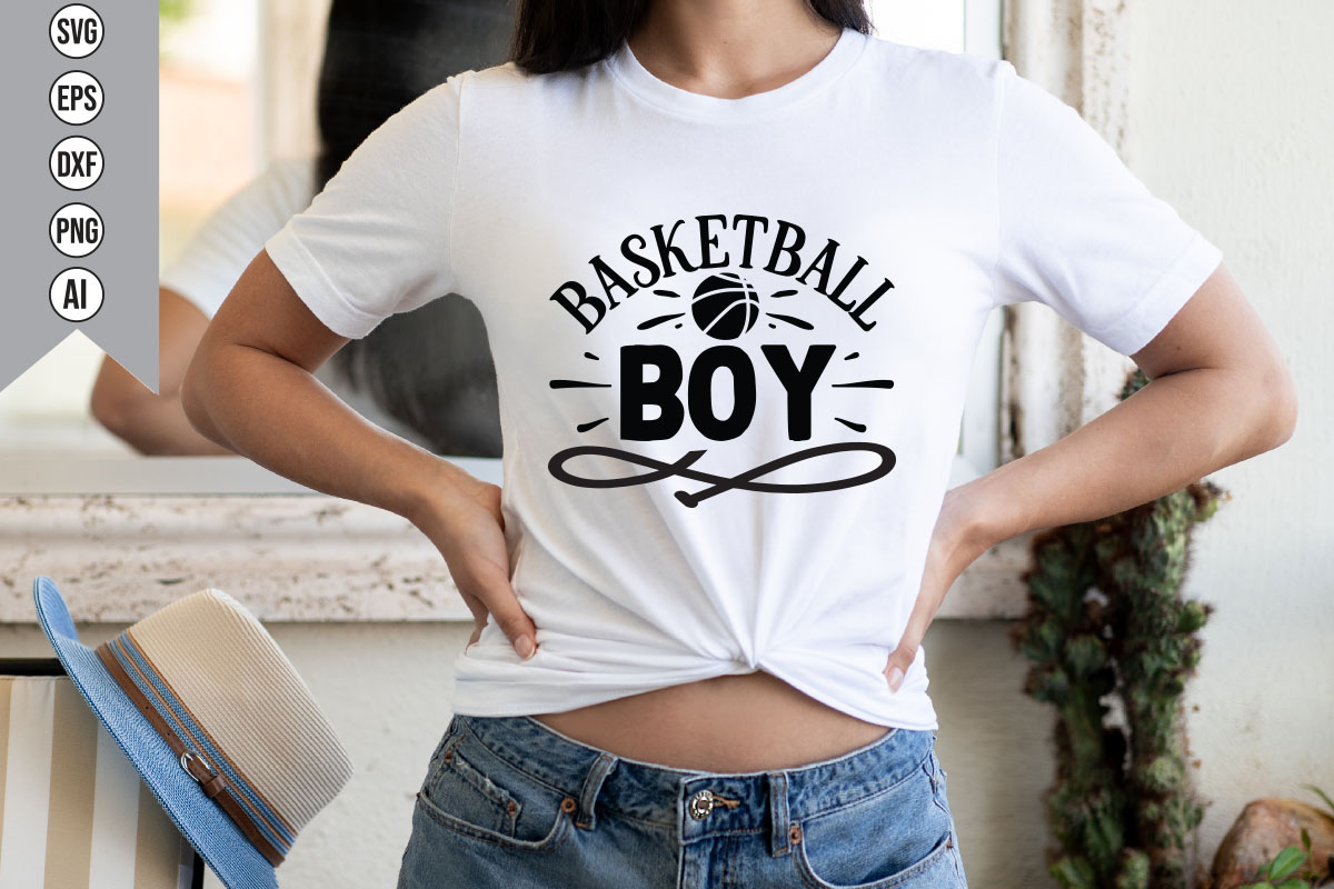 Woman wearing a white shirt that says basketball boy.