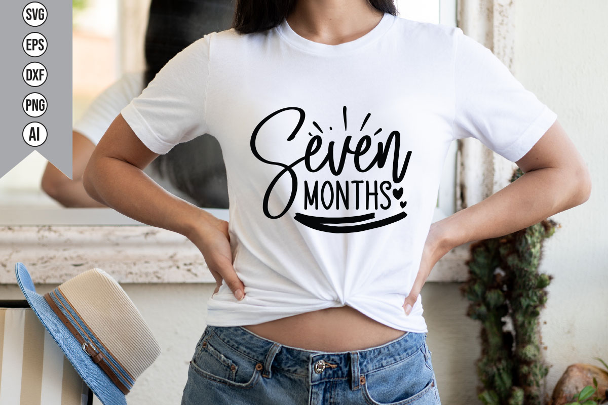 Woman wearing a t - shirt that says seven months.