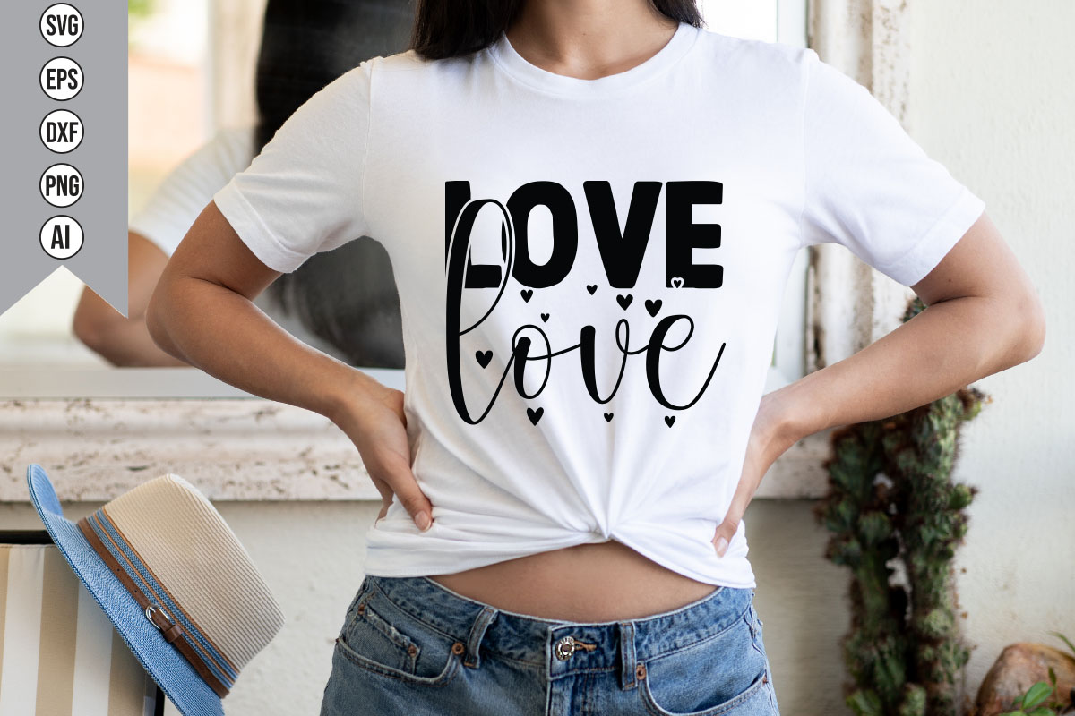 Woman wearing a t - shirt with the word love on it.
