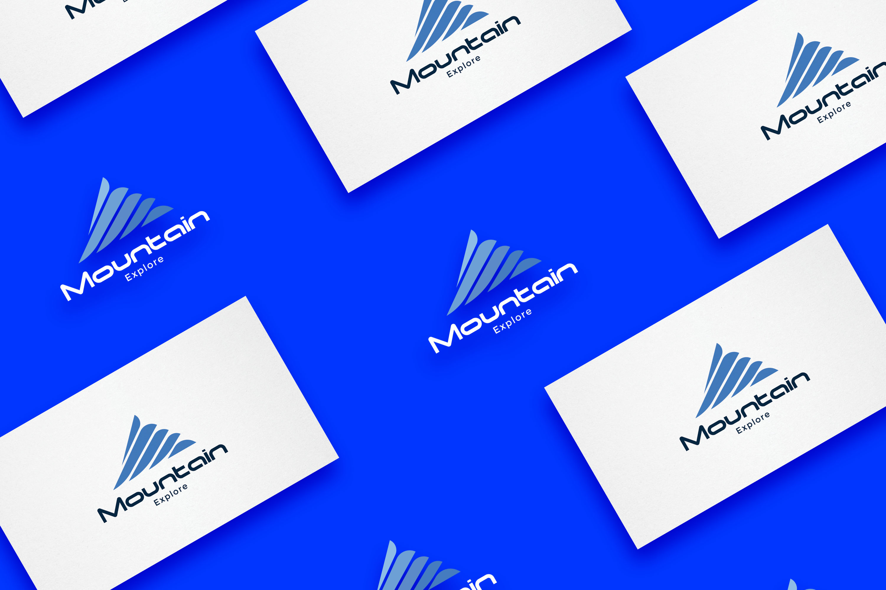 Bunch of business cards that are on a blue surface.