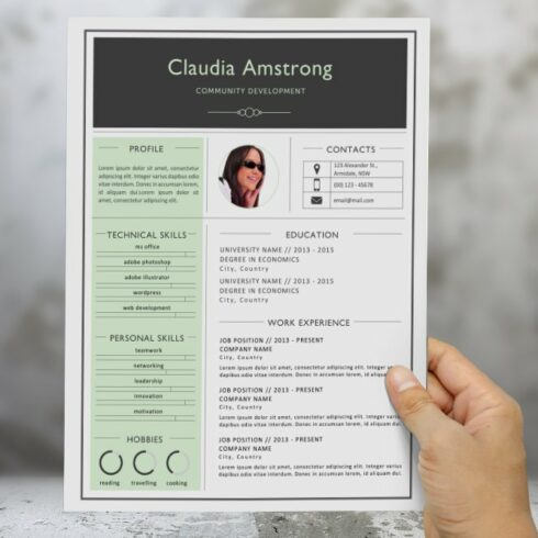 Person holding a resume in their hand.