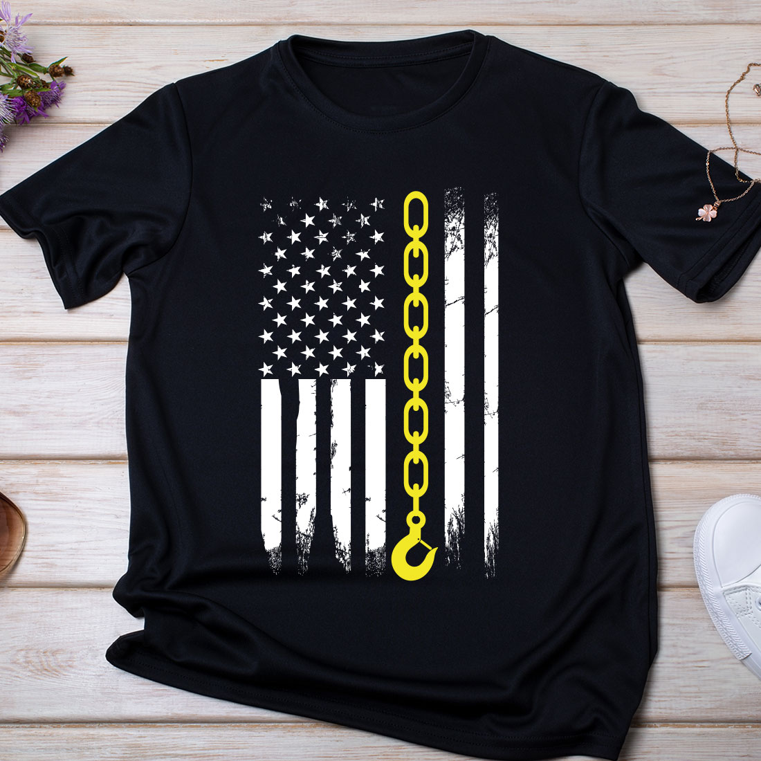 Black t - shirt with an american flag and a gold key on it.