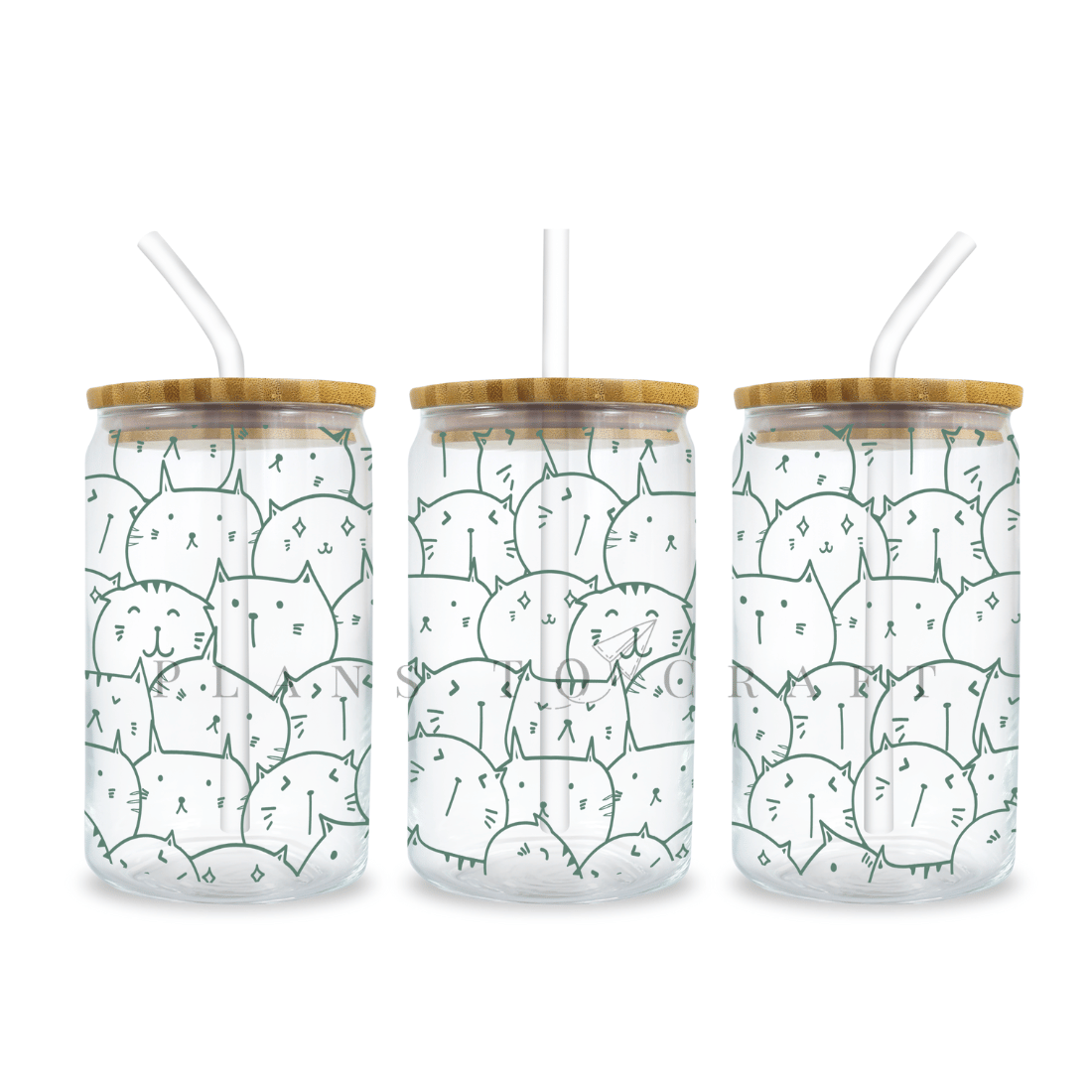 Three glass jars with straw lids with animals on them.