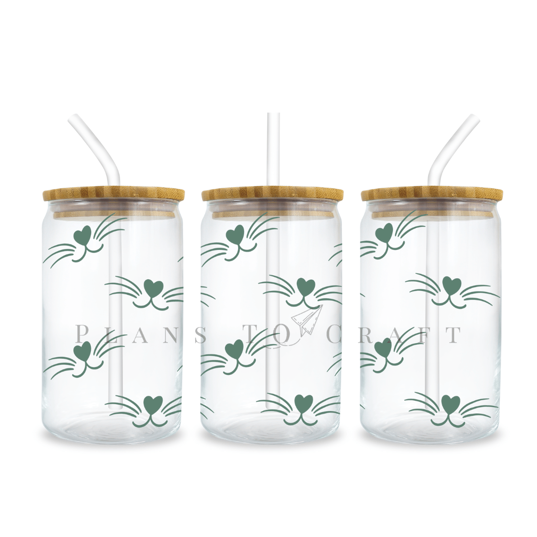Three glass jars with straws and a wooden lid.
