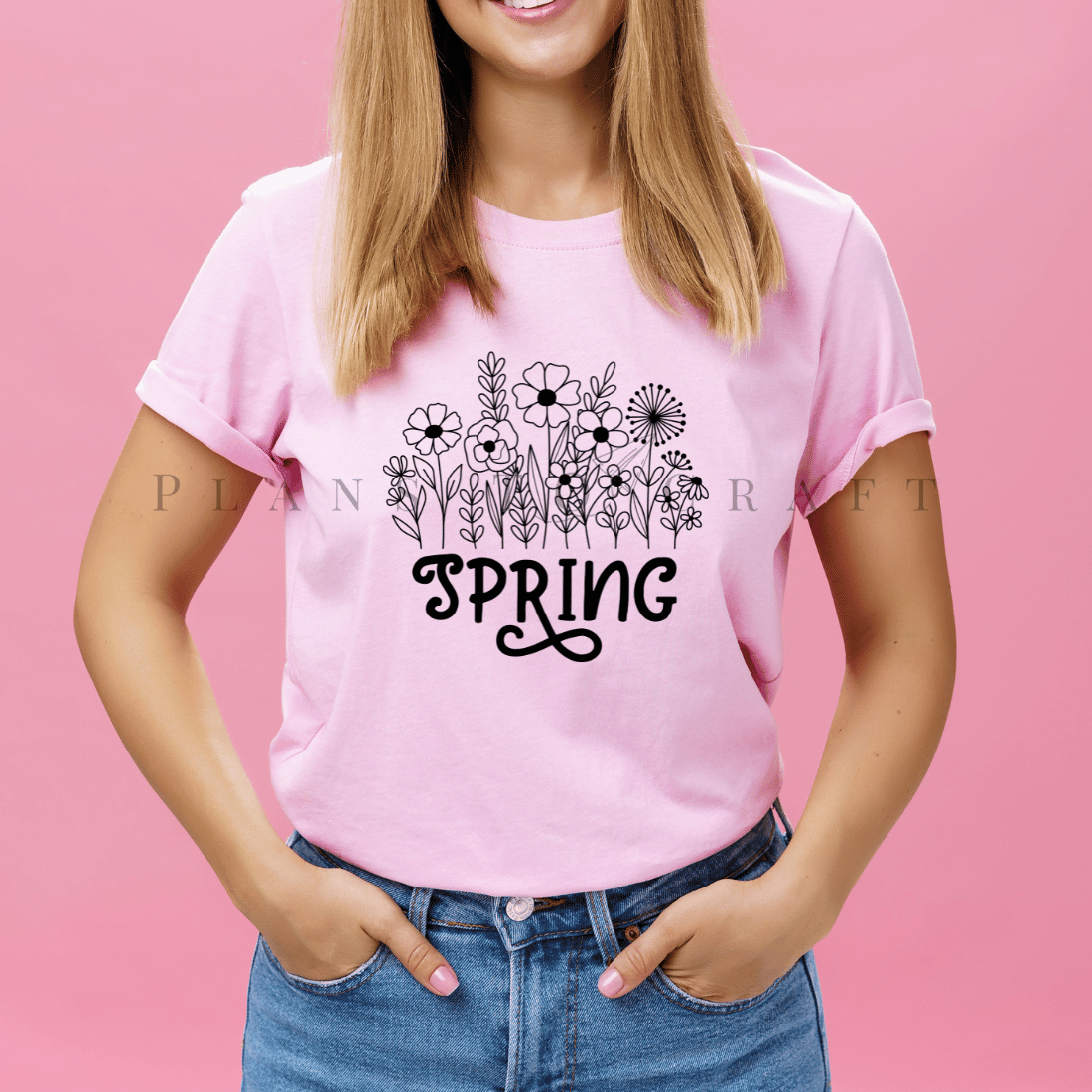 Woman wearing a pink shirt that says spring.
