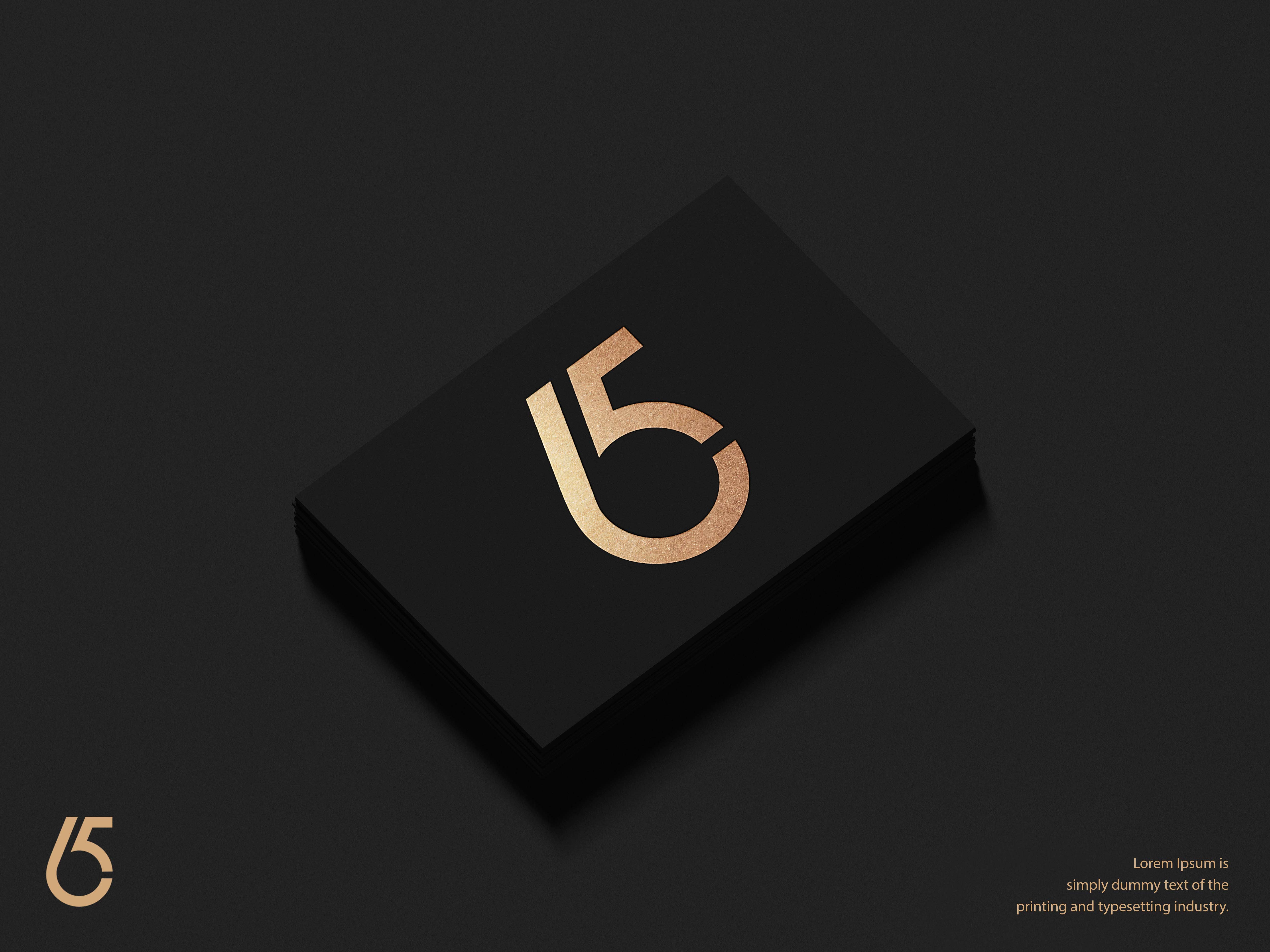 Black and gold business card with the number fifteen on it.