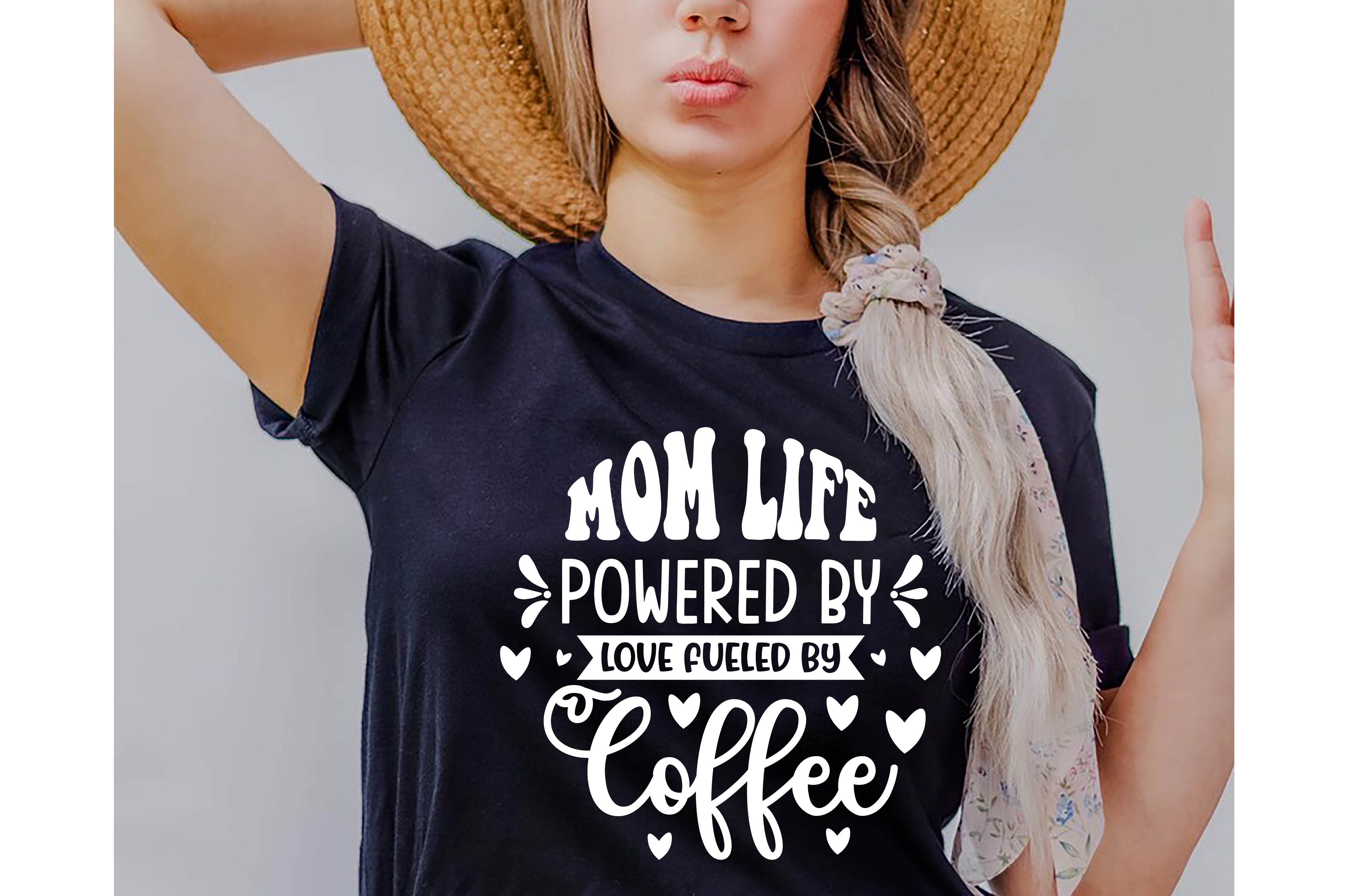 Woman wearing a mom life powered by coffee shirt.