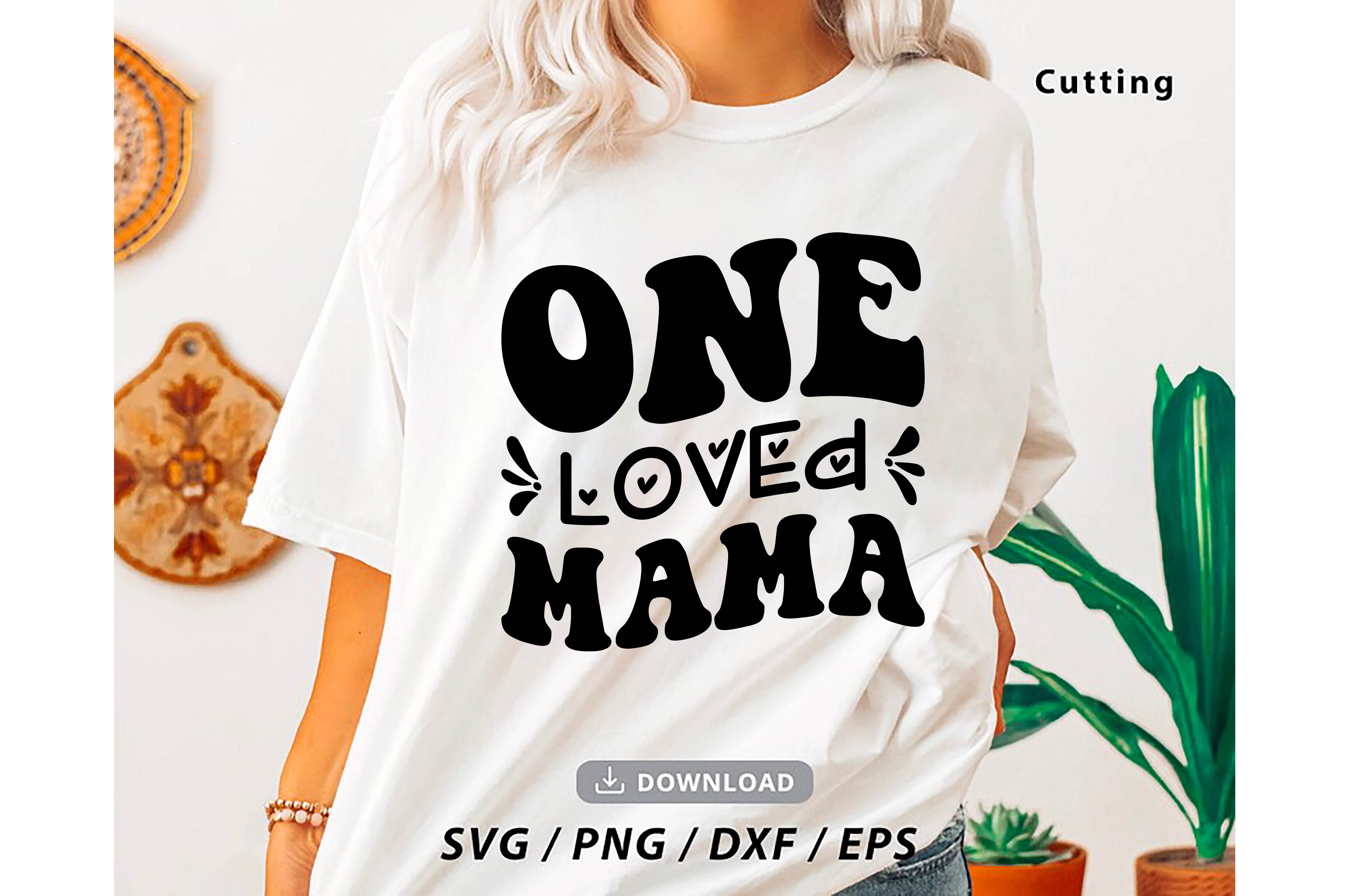 Woman wearing a t - shirt that says one loved mama.