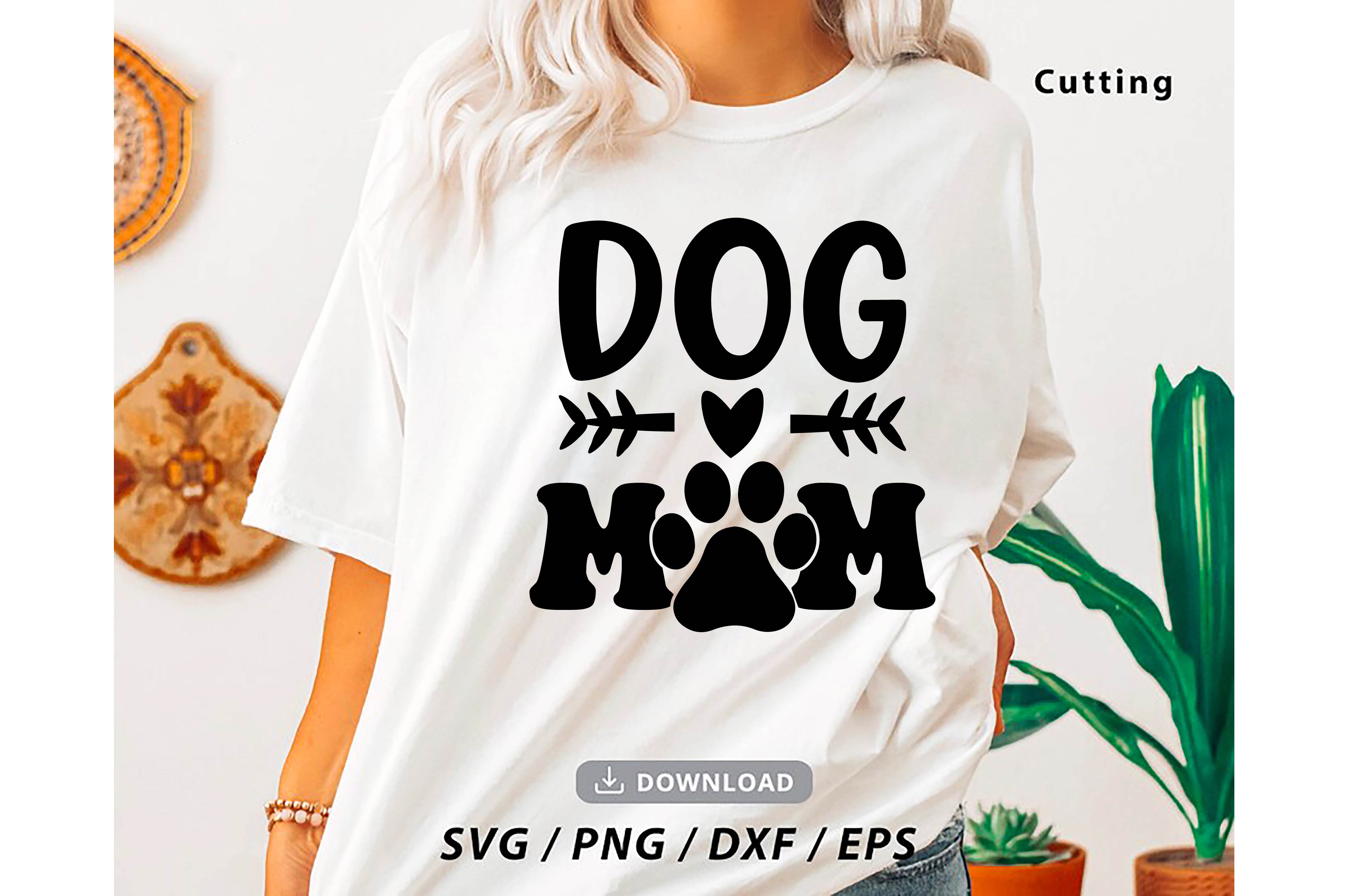 Woman wearing a dog mom t - shirt.