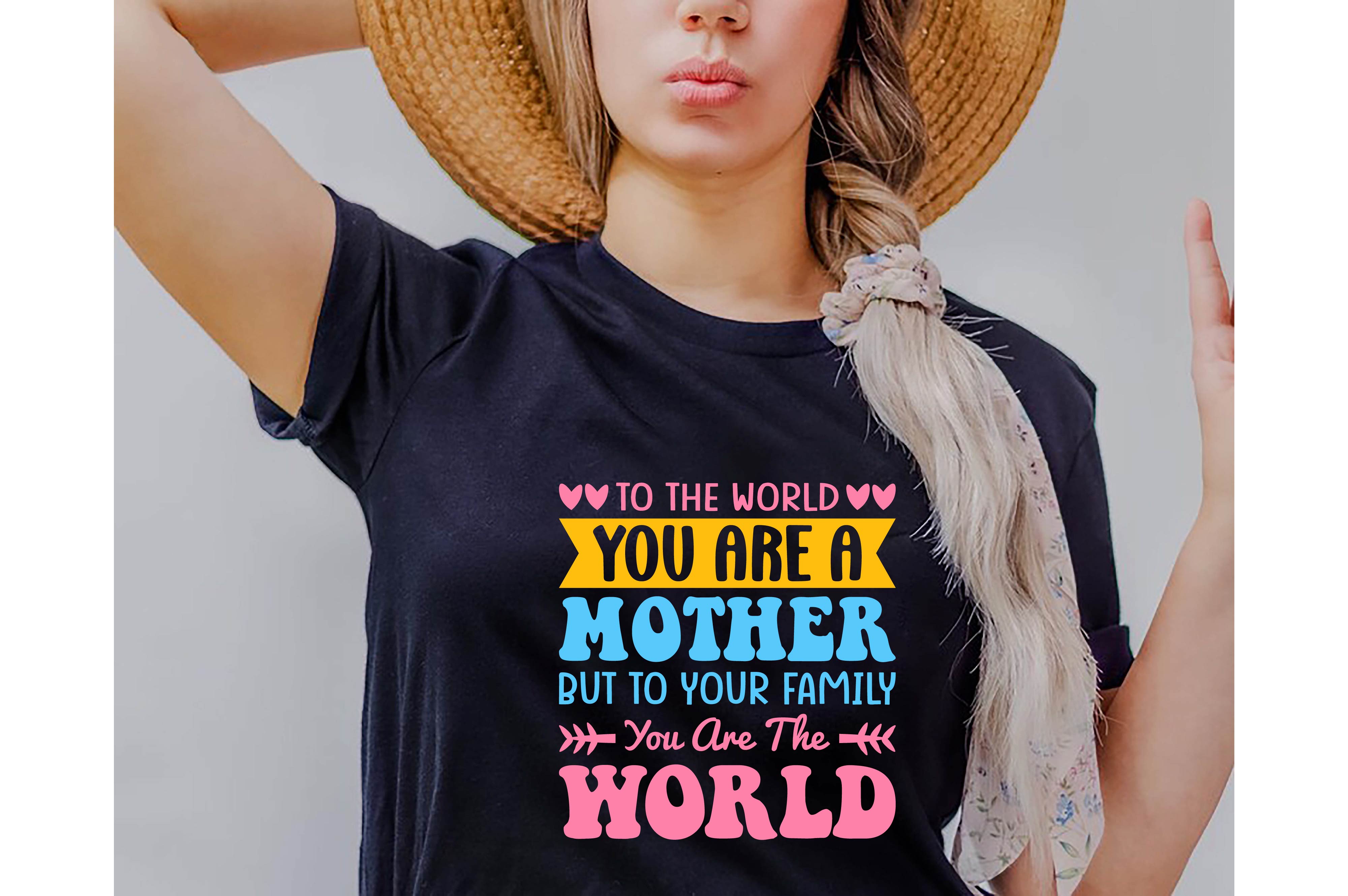 Woman wearing a t - shirt that says to the world you are a mother.