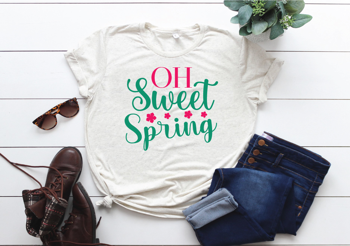 T - shirt that says oh sweet spring next to a pair of jeans and.