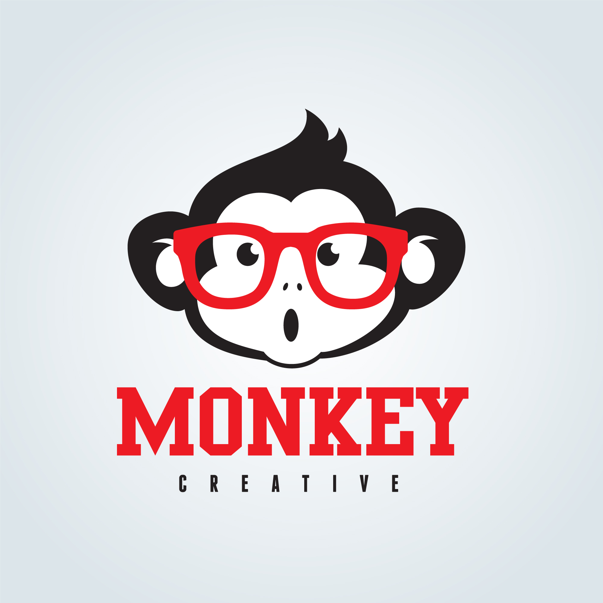 Monkey with red glasses on it's face.