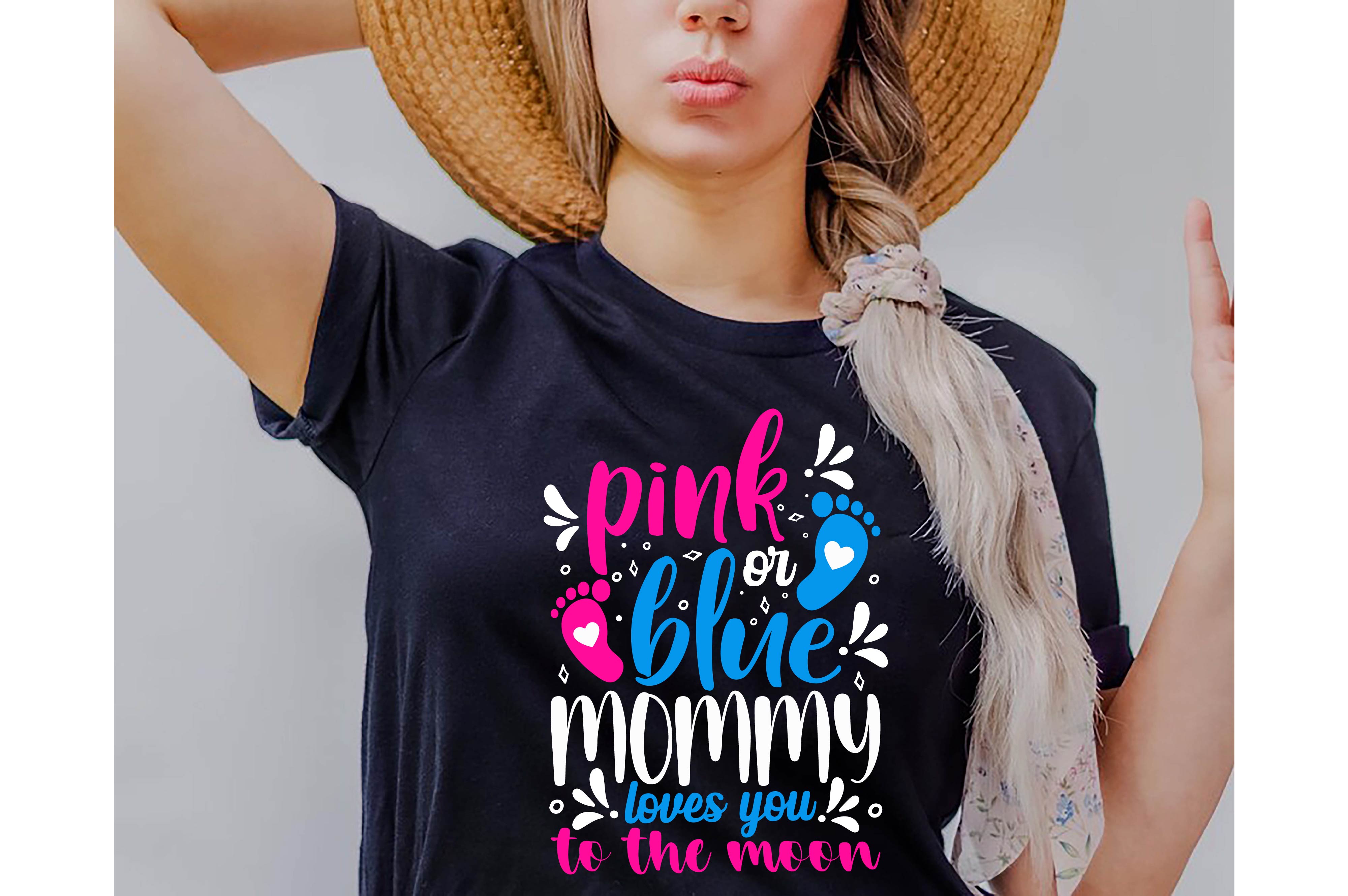 Woman wearing a pink or blue mommy shirt.