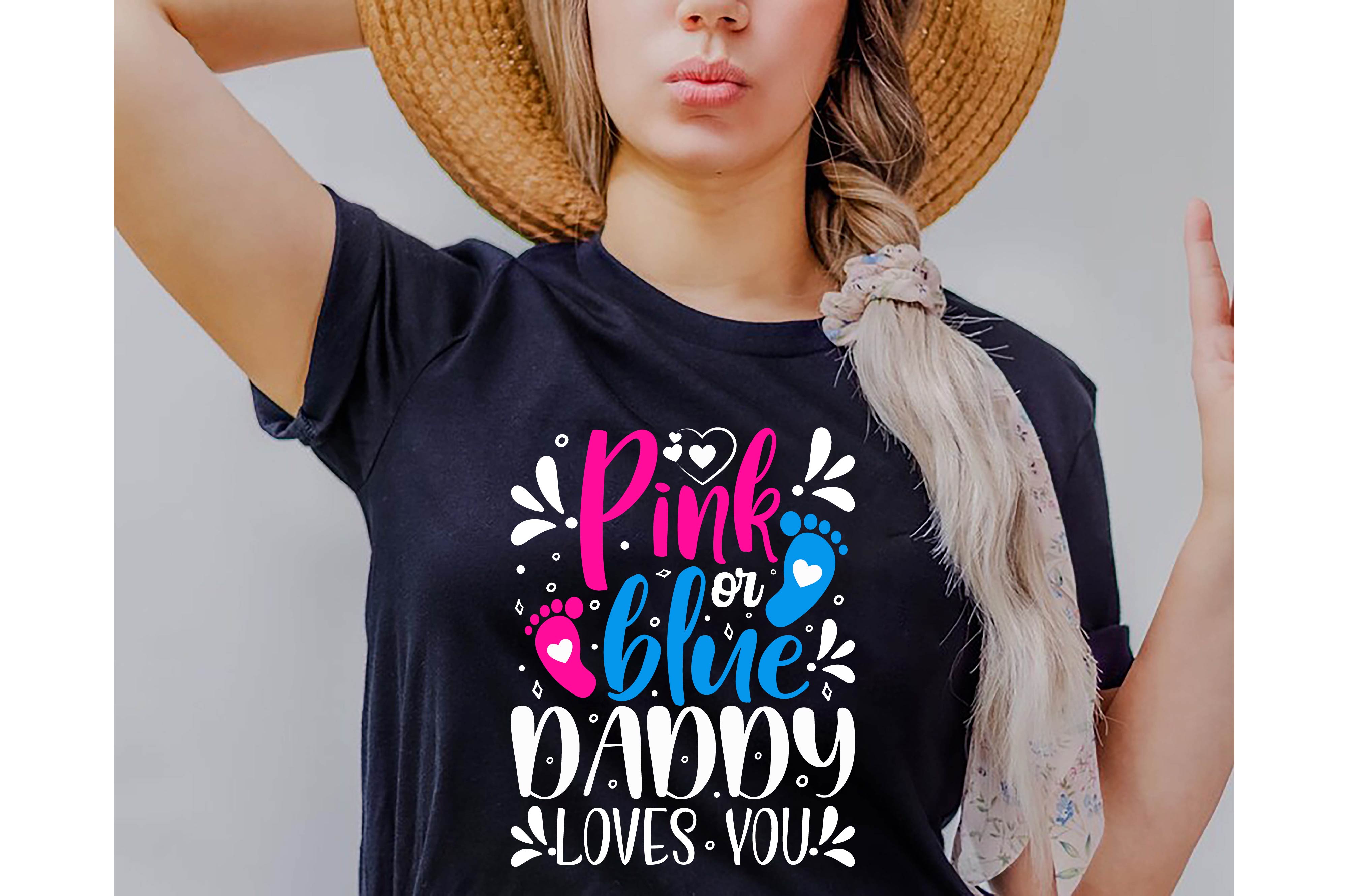 Woman wearing a t - shirt that says pink or blue mommy loves you.