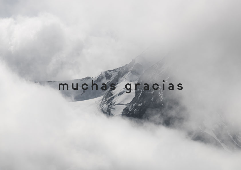 Mountain covered in clouds with the words munchas glacias.