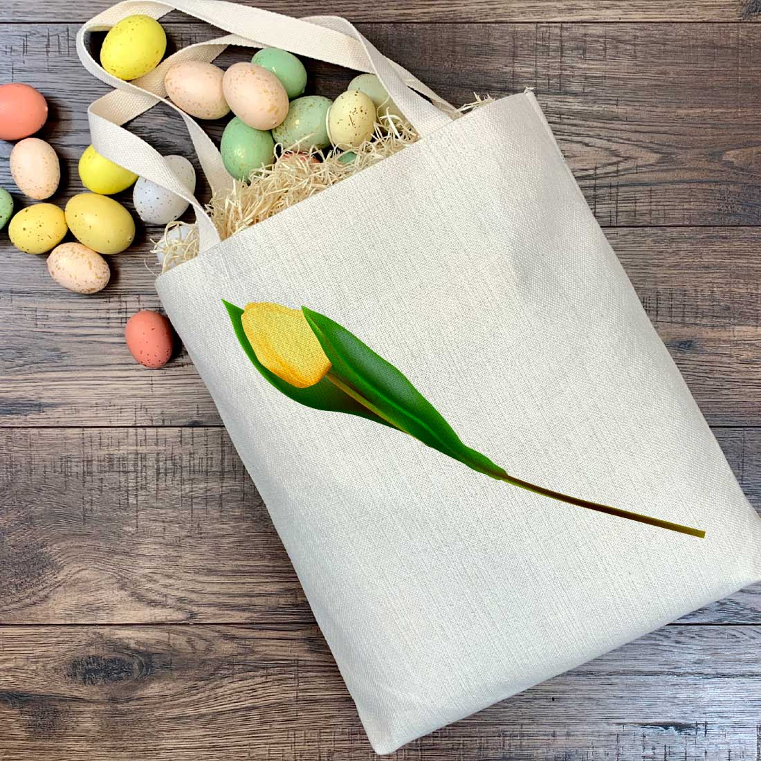 White bag with a yellow flower and eggs.
