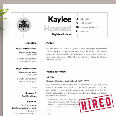 Resume with a stamp on it next to a pen and a plant.