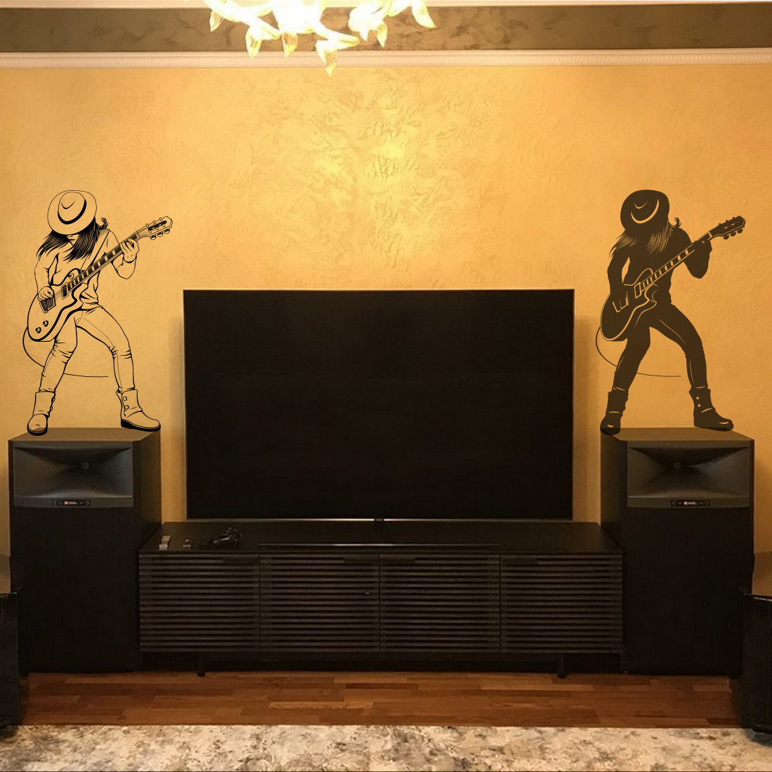 Living room with a tv and a guitar player on the wall.