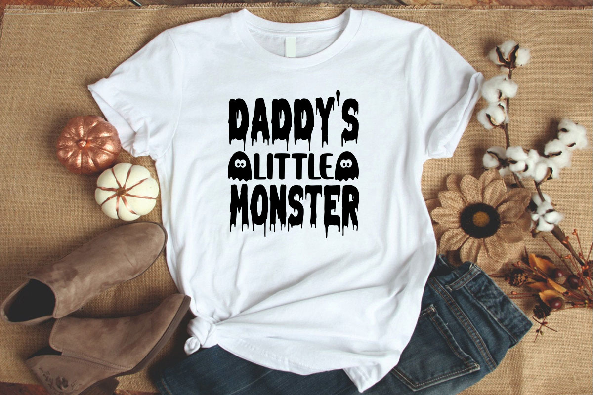 White shirt with the words daddy's little monster on it.