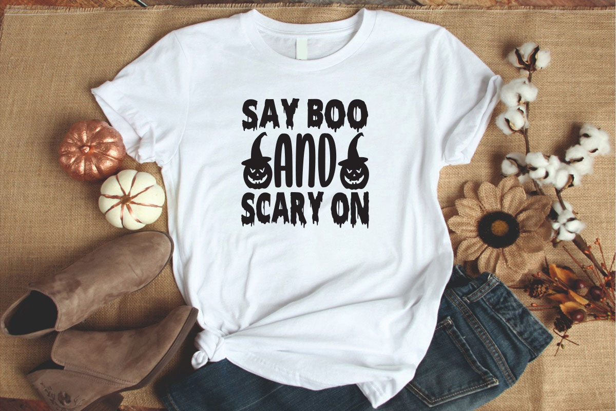 T - shirt that says say boo and scary on.