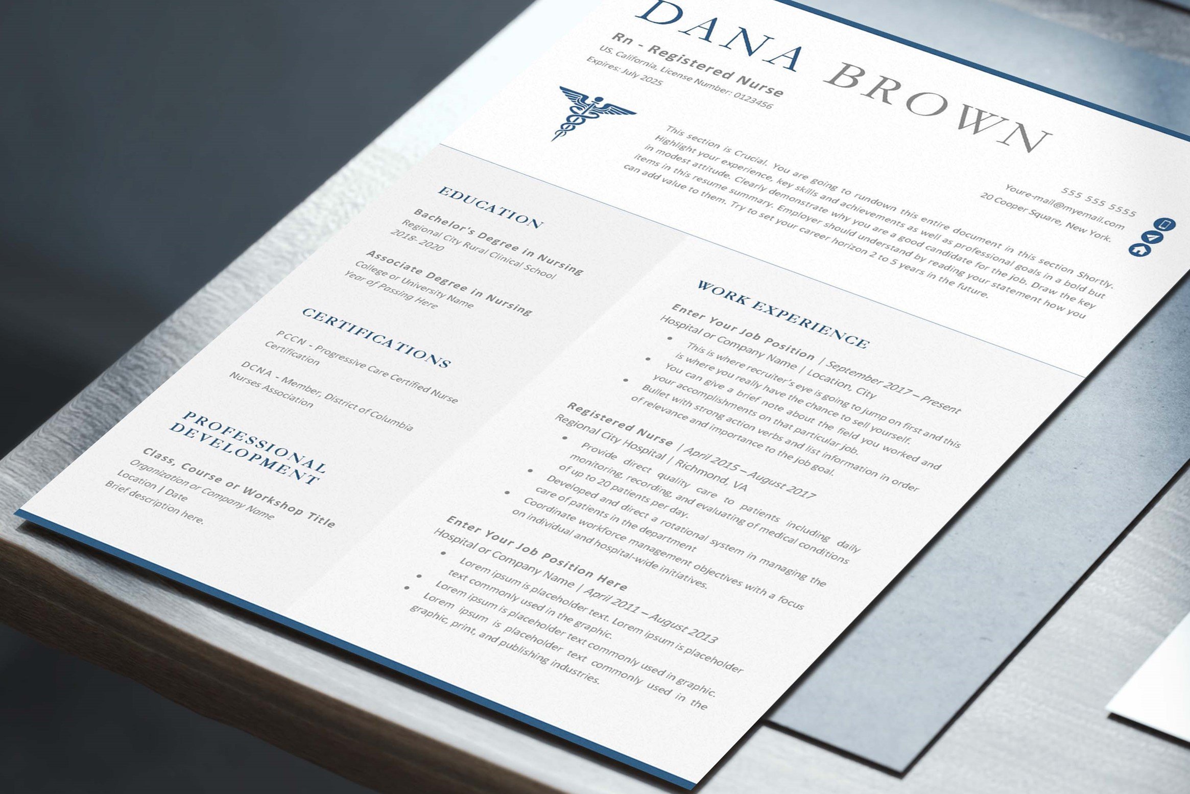 Professional resume is displayed on a table.